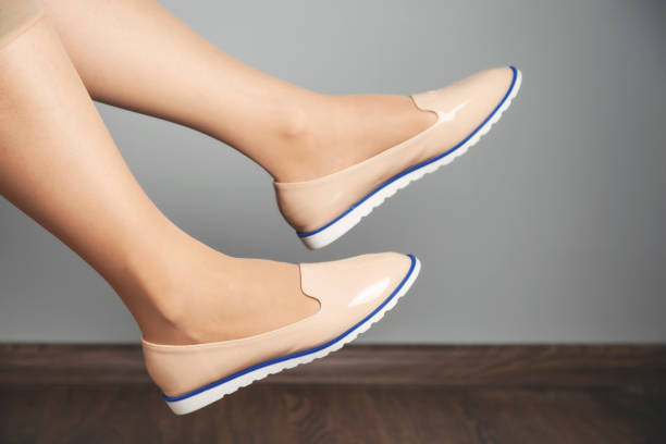 istock woman foot with shoes 1183171058