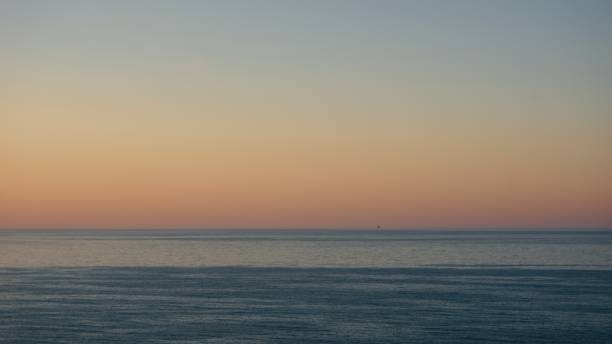 istock Sunset over Adriatic sea with mining platform in the distance 1183175677