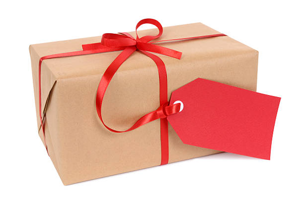 istock Brown paper package with red ribbon and tag 118317611