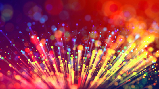 Abstract explosion of multicolored shiny particles or light rays like laser show. 3d render abstract beautiful background with light rays colorful glowing particles, depth of field, bokeh