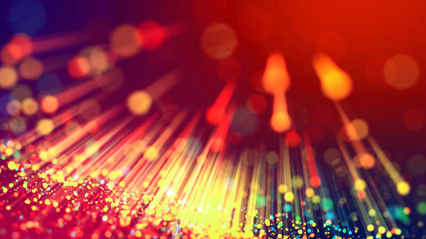 istock Abstract explosion of multicolored shiny particles or light rays like laser show. 3d render abstract beautiful background with light rays colorful glowing particles, depth of field, bokeh. 1183185054