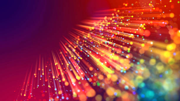 istock Abstract explosion of multicolored shiny particles or light rays like laser show. 3d render abstract beautiful background with light rays colorful glowing particles, depth of field, bokeh. 1183185545
