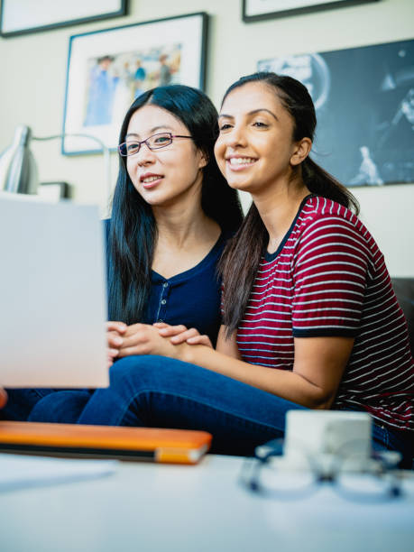 istock Financial advisor talking to Lesbian couple 1183185892