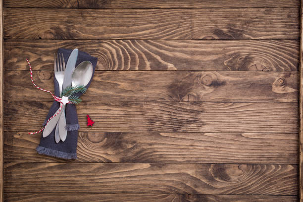 istock Christmas table place setting with grey linen napkin on the wooden background 1183190046
