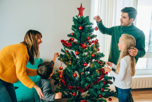 istock Family decorating the Christmas tree 1183191754