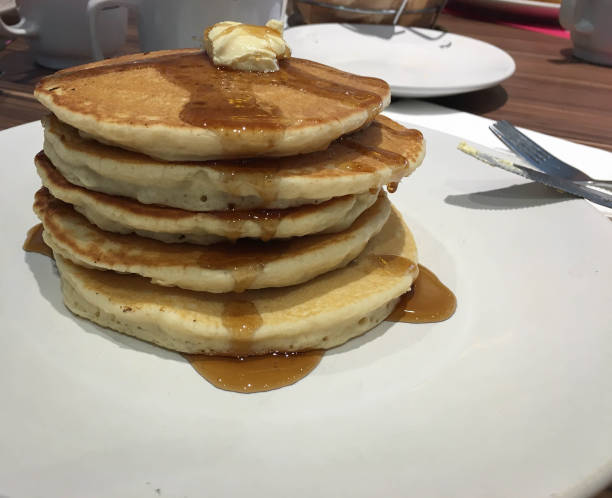 istock stack of four buttermilk pancakes and some maple syrope for breackfast 1183195397