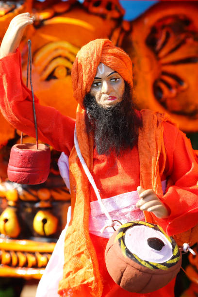 istock Indian Priest Sadhu Devotee Saint in Beards Playing Music Statue Cultural Traditional 1183196992