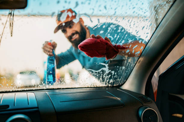 istock Handsome man washing car 1183197511