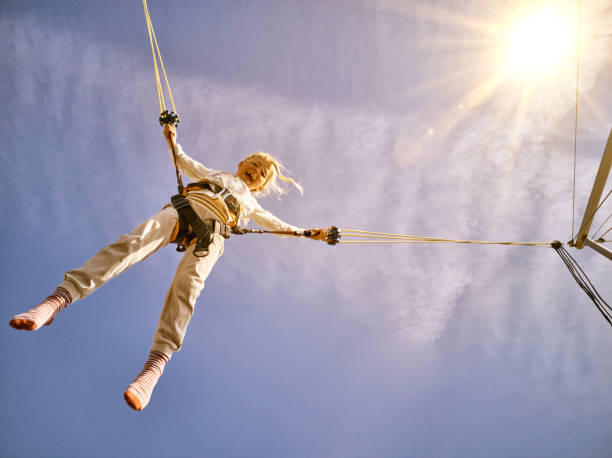 istock A girl jumps high up 1183200003