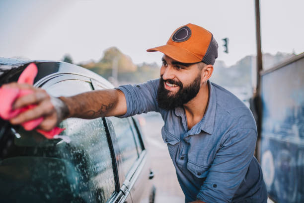 istock Handsome men washing car 1183200269