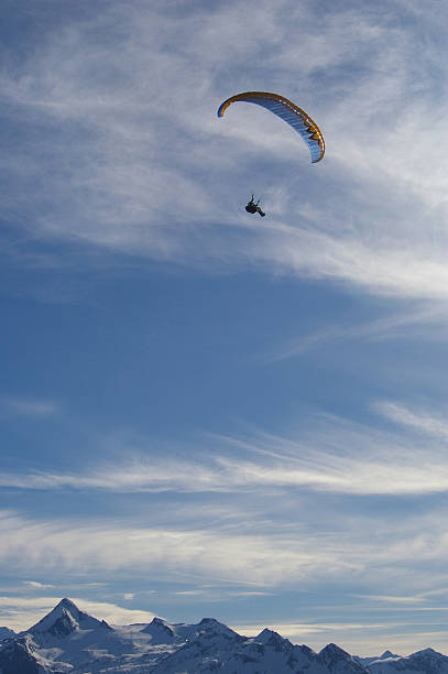 istock winter paragliding over alps mountains 118320689