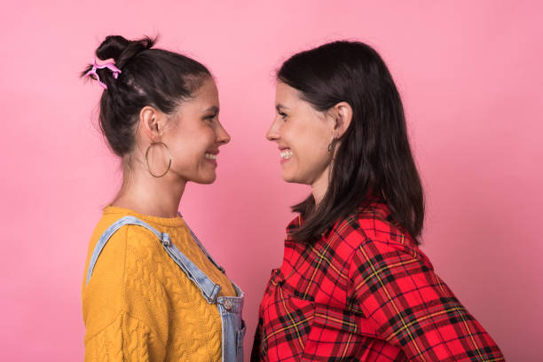 istock Beautiful twin sisters posing 1183208834