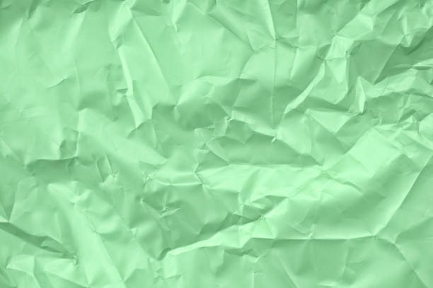 istock Crumpled mint satin paper texture 1183213550