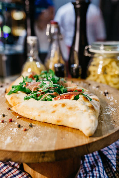 Pizza with prosciutto and figs