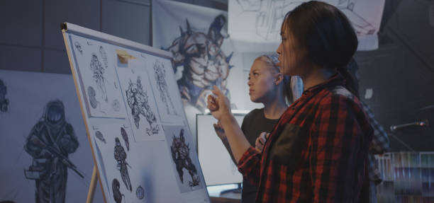 istock Female designers discussing video game art 1183215551