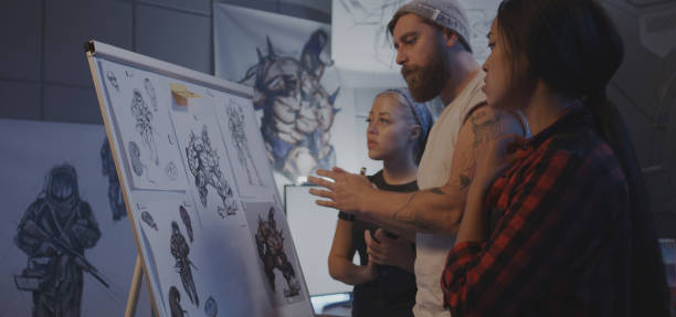 istock Female designers discussing video game art 1183215594