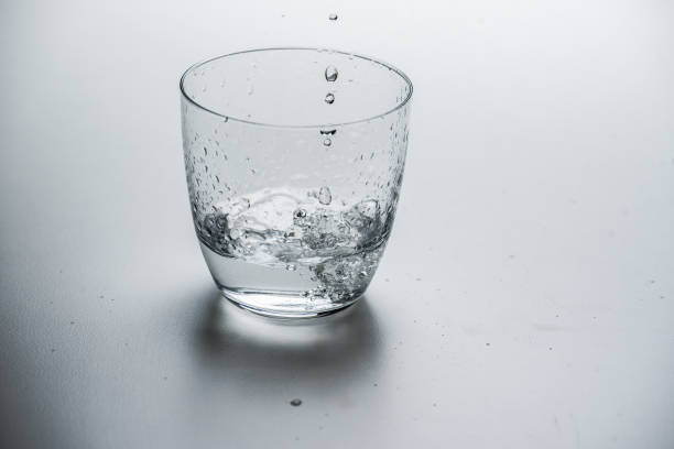 istock glass with water on a white background 1183215725