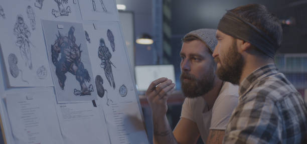 istock Male designers discussing video game art 1183215796