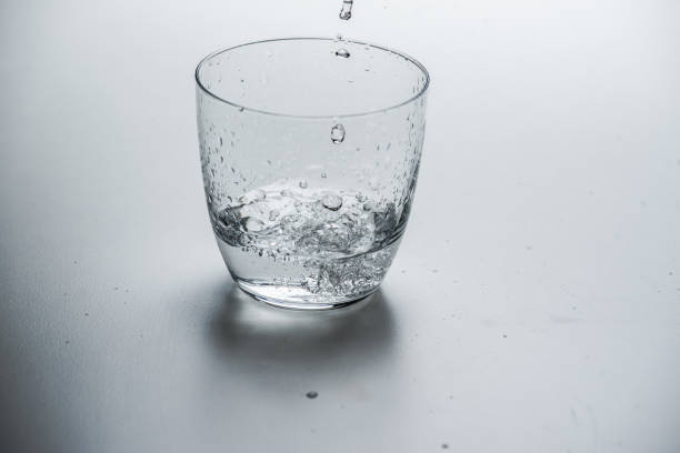 istock glass with water on a white background 1183215852