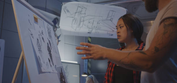 istock Designers discussing video game art 1183215863
