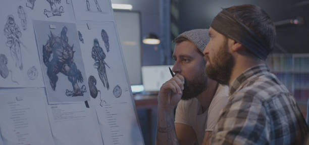 Male designers discussing video game art