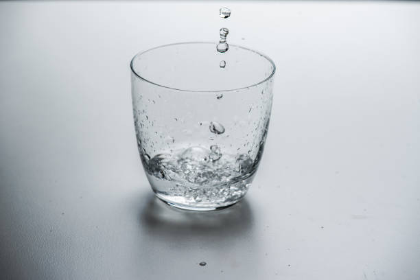 istock glass with water on a white background 1183217222