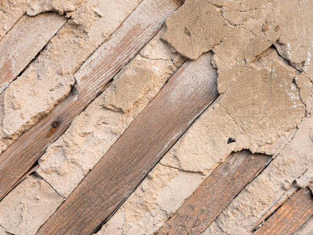 istock Wooden boards in concrete wall. 1183217619