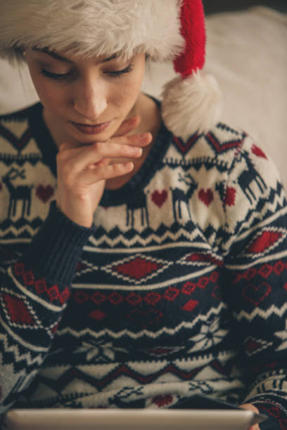 istock Woman using tablet at home during Christmas time 1183219478