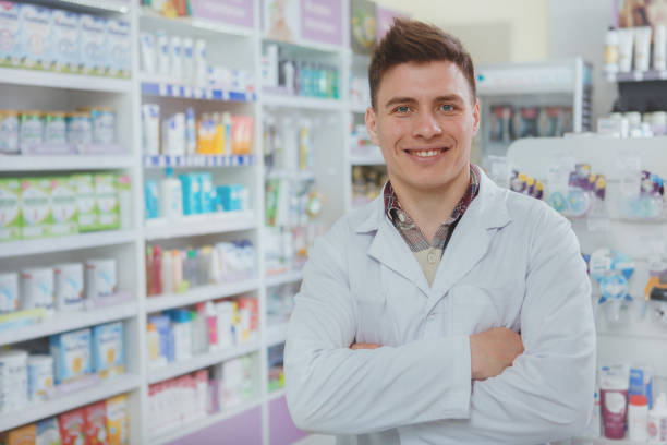 istock Young pharmacist working at his drugstore 1183219699