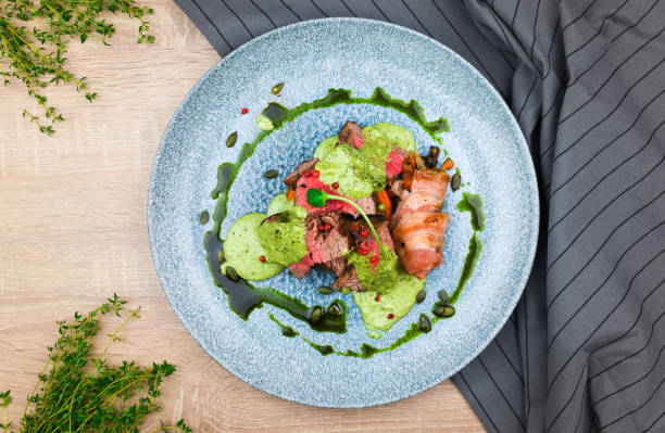 istock Steak with green sauce and pumpkin 1183221516