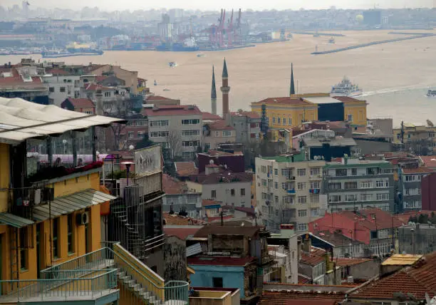 View of Istanbul and Bosphorus from Beyoglu Galatasaray district. Istanbul's old buildings, cafes, minarets and ferries. Horizontal close-up detail.