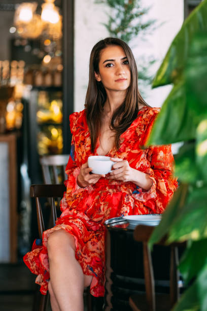 istock Attractive Woman Drinking Coffee in Cafe 1183223952