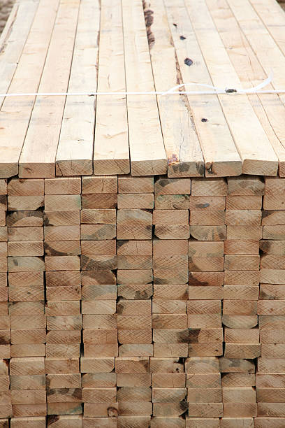 istock Stack of 2x4 lumber at the job site 118322435