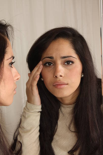 Face examination stock photo