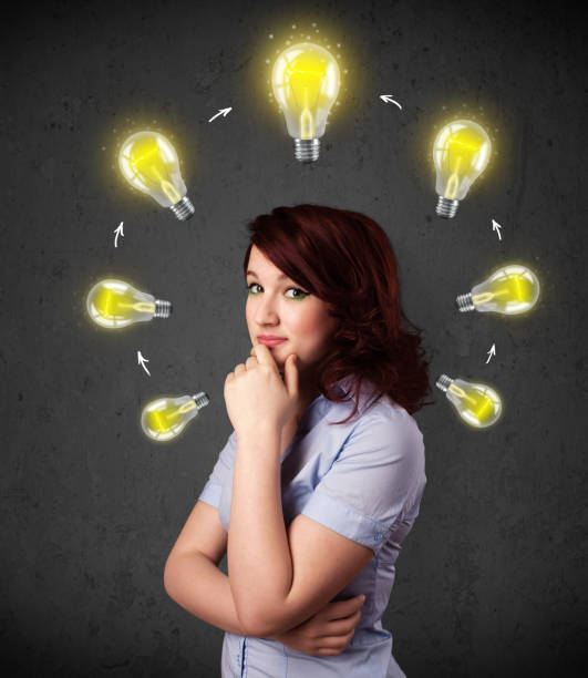 istock Young woman thinking with lightbulb circulation around her head 1183225025