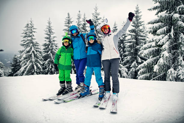 istock Skiing family having fun on winter day 1183225480