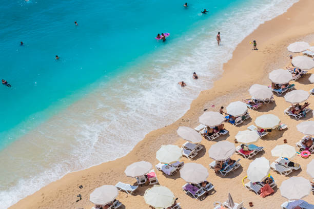 istock Sea waves and beach with sun umbrellas, aeral view, Kaputash beach 1183226421