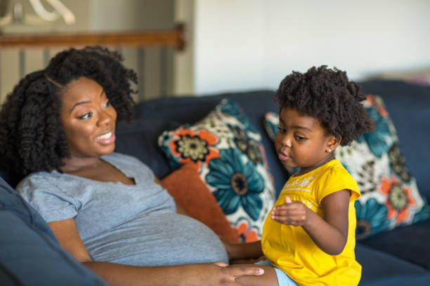istock African American mother playing and talking with her daughter. 1183226503