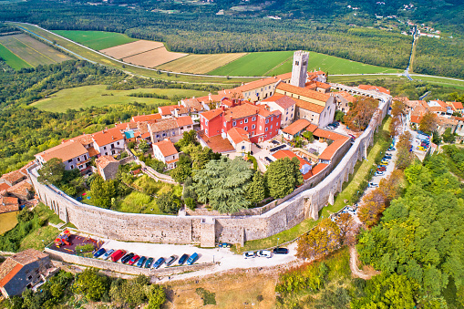 Motovun. Aerial view of idyllic hill town of Motovun surrounded by defense stone walls and Mirna river valley. Istria region of Croatia