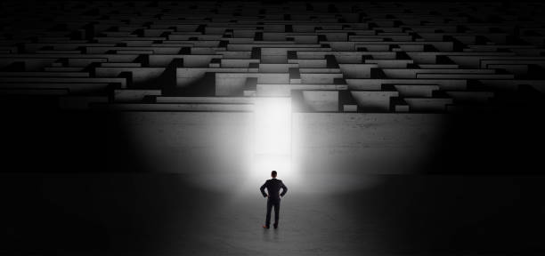 istock Businessman starting a dark labyrinth challenge 1183227511