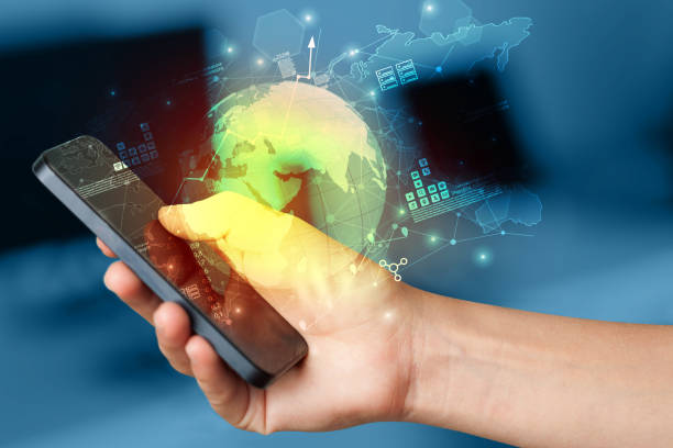 istock Hand using phone  with worldwide reports links and statistics concept 1183227795