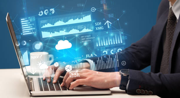 istock Hand typing on laptop graphs and charts and reports concept around 1183227900