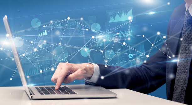 istock Hand typing on laptop with linked report and charts around 1183228016