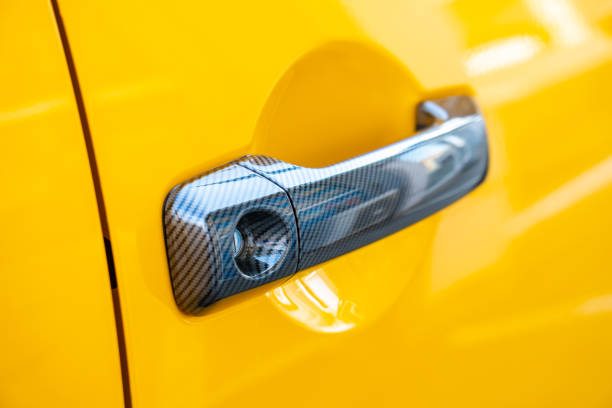 istock Car Door Lock and Handle. Yellow color. 1183228149