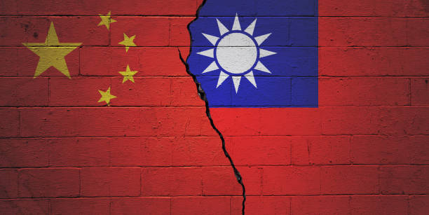 China vs Taiwan Cracked brick wall painted with an Chinese flag on the left and a Taiwanese flag on the right. taiwan photos stock pictures, royalty-free photos & images