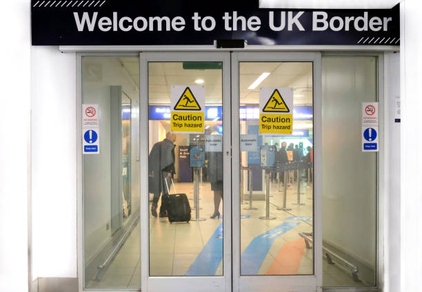 A sign with the words "Welcome to the UK Border" stock photo