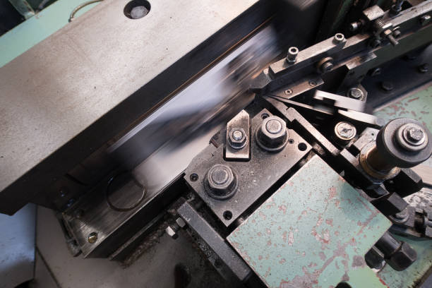 Close up on a metal production line detail by an industrial plant