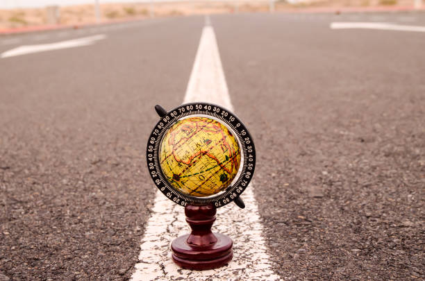 istock Globe Earth on an Asphalt Street 1183240083