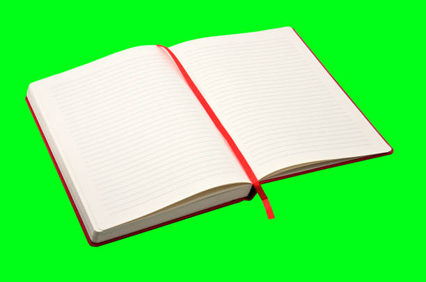 red notebook on a green background - book photo album publication open imagens e fotografias de stock