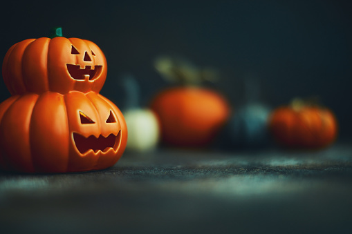 Halloween background with Jack O'Lantern and pumpkins